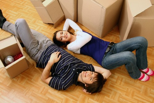 Apartment move-out scene in Elephant and Castle with boxes and movers